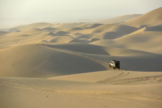 Vehicle in the dunes near Sandwich Harbour, Namib-Naukluft-Park, Namibia, Africa