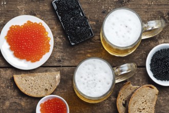 Different kinds of caviar with bread and beverages, AI generated