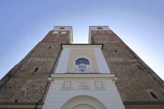 View upwards to double towers of the Romanesque Nikolaikirche, Buttermarkt, Freiberg, Saxony,