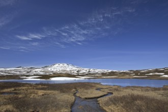 Cirrus uncinus clouds above the hills of Borgafjäll, Borgafjaell in Jämtland, northern Sweden