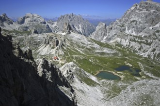 Via ferrata de Luca near Tre Cime di Lavaredo, Drei Zinnen. View on the mountain refuge Rifugio Tre