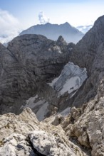 View of rock faces with blue ice glacier and summit of the Hochkalter, Berchtesgaden Alps, Bavaria,