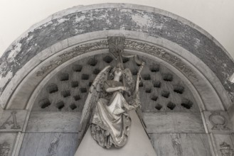 Angel playing the harp, sculpture on a family tomb, Monumental Cemetery, Cimitero monumentale di