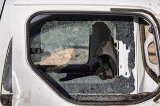 Car, shattered window, side window, total loss after flood, flood damage after flood disaster in