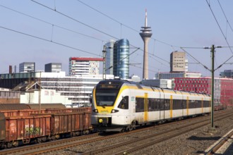 S-Bahn station, Düsseldorf-Hamm stop, Düsseldorf city centre skyline, Media Harbour, local train,