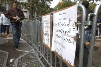 Refugees from Syria waiting to be registered at the Central Reception Centre for Asylum Seekers at