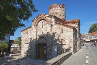 Old Byzantine church with characteristic brick architecture and small windows, Church of St John