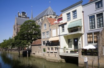 Canal waterside buildings near the Big Grote cathedral church, Dordrecht, Netherlands