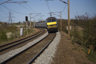 Greater Anglia Class 90 electric locomotive train on the Norwich to London line, England, UK