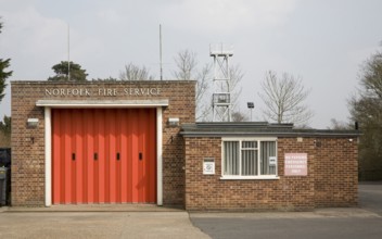 Red doors of small fire station at Loddon, Norfolk, England, United Kingdom, Europe