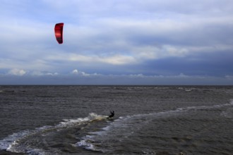 Kite surfing in North Sea at Shingle Street, Suffolk, England, UK