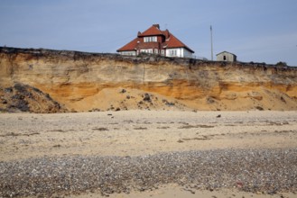 House on cliff top subsequently demolished in March 2011 because of coastal erosion, Easton