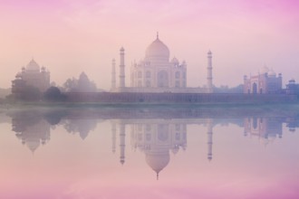 Taj Mahal on sunrise sunset reflection in Yamuna river panorama in fog, Indian Symbol, India travel