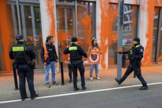 Police confiscate Last Generation banner after colour attack on Total Energies building Berlin, 06