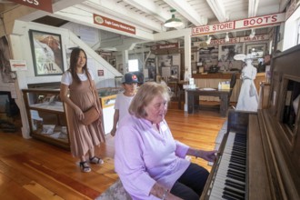 Eagle, Colorado, The Eagle County Historical Museum. A museum worker operates a player piano for