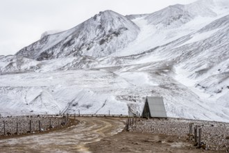 Simple restroom at the parking lot, early snow, Hveradalir geothermal area, Kerlingarfjöll,