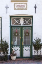 Old decorative front door in a historic house, Tönning, Nordfriesland district, Schleswig-Holstein,