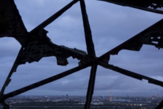 View of the city of Berlin with radio tower and television tower through a radar dome on the former