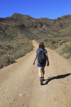 Woman walking in Cabo de Gata national park, Monsul, near San José, Almeria, Spain, Europe