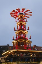 Illuminated Christmas pyramid at the market, Glühweinsatnd, Christmas market, Blue hour, Paderborn,