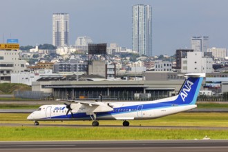 An ANA Wings Dash 8 Q400 aircraft with registration number JA847A at Itami Airport (ITM) in Osaka,