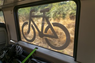 Bicycle storage area with window sign on Greater Anglia train, Suffolk, England, UK