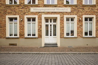 Historic brick building of Wohnungsbaugenossenschaft Warendorf e.G. in Warendorf, district of