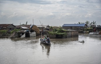 Morigaon, India. 4 July 2024. A settlement is partially submerged in flood in Morigaon district in