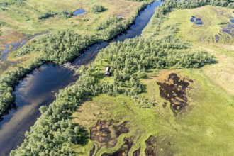 Aerial view of a lonely house at a river, central Senja island, Norway, Europe