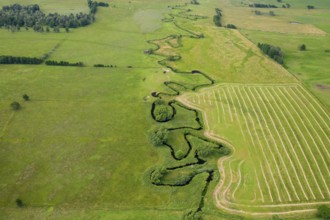 Aerial view over meander belt in meandering Klingavälsån river, tributary to Kävlingeån in the