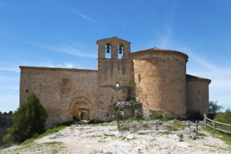 Lonely medieval church with stone walls and bell tower under a clear blue sky, Ermita de San