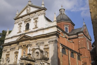 Saints Peter and Paul Church facade decorated with carved statues and sculptures, Cracow, Poland,