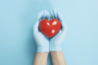 Hands with blue medical gloves holding red heart. KI generiert, generiert AI generated