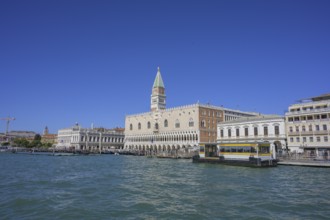 Vaporetto landing stage S Zaccaria behind St Mark's Square tower and Palazzo Ducale, Venice,