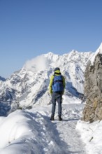 Mountaineers on the way to the Jenner summit with snow, snowy mountain panorama with Watzmann