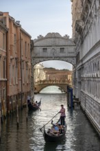 Venetian gondolas on the Rio di Palazzo canal with Bridge of Sighs, Venice, Veneto, Italy, Europe