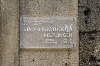 Sign on the old schoolhouse, building from 1867 made of Gönningen tuff, former elementary and