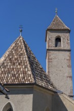 Church in the village of Montiggl, colourful shingle roof, on the South Tyrolean Wine Road, near