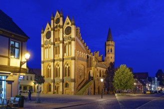 Tangermünde town hall on the market square, surrounded by half-timbered houses, illuminated in the