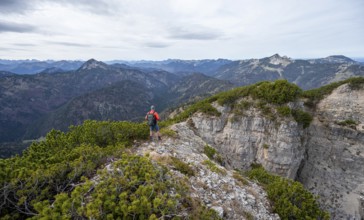 Hiker on the Schinder, Tegernsee mountains in the Mangfall mountains, Germany, Europe