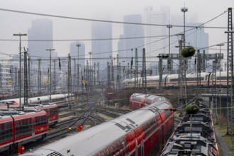 Railway tracks with regional and long-distance trains, ICE, after freezing rain, in front of