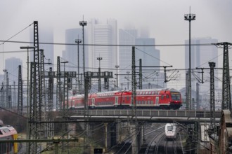 Railway tracks with regional trains, after freezing rain, in front of Frankfurt main station,