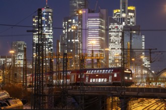 Railway tracks in front of the main railway station in Frankfurt am Main, skyline of skyscrapers in