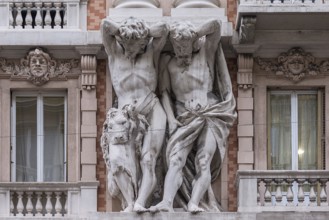 Two atlases on a historic house facade, Genoa, Italy, Europe