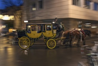 Historic horse-drawn stagecoach with visitors from the Christkindlesmarkt, Nuremberg, Middle