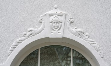 Relief of a boy's head above the fenaster of the oldest kindergarten in Lauf, 1850, Alter Schulhof