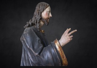 Christ on the palm donkey, wooden figure from around 1880, on a dark background, Dominican convent