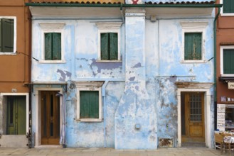 Peeling paint on the façade of a residential building, Burano, Venice, Veneto, Italy, Europe