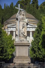 Large statue of a saint at the entrance to the Staglieno Monumental Cemetery, Cimitero Monumentale