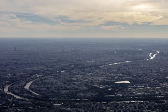 Expansive landscape with a river meandering through the city, flight, aerial view